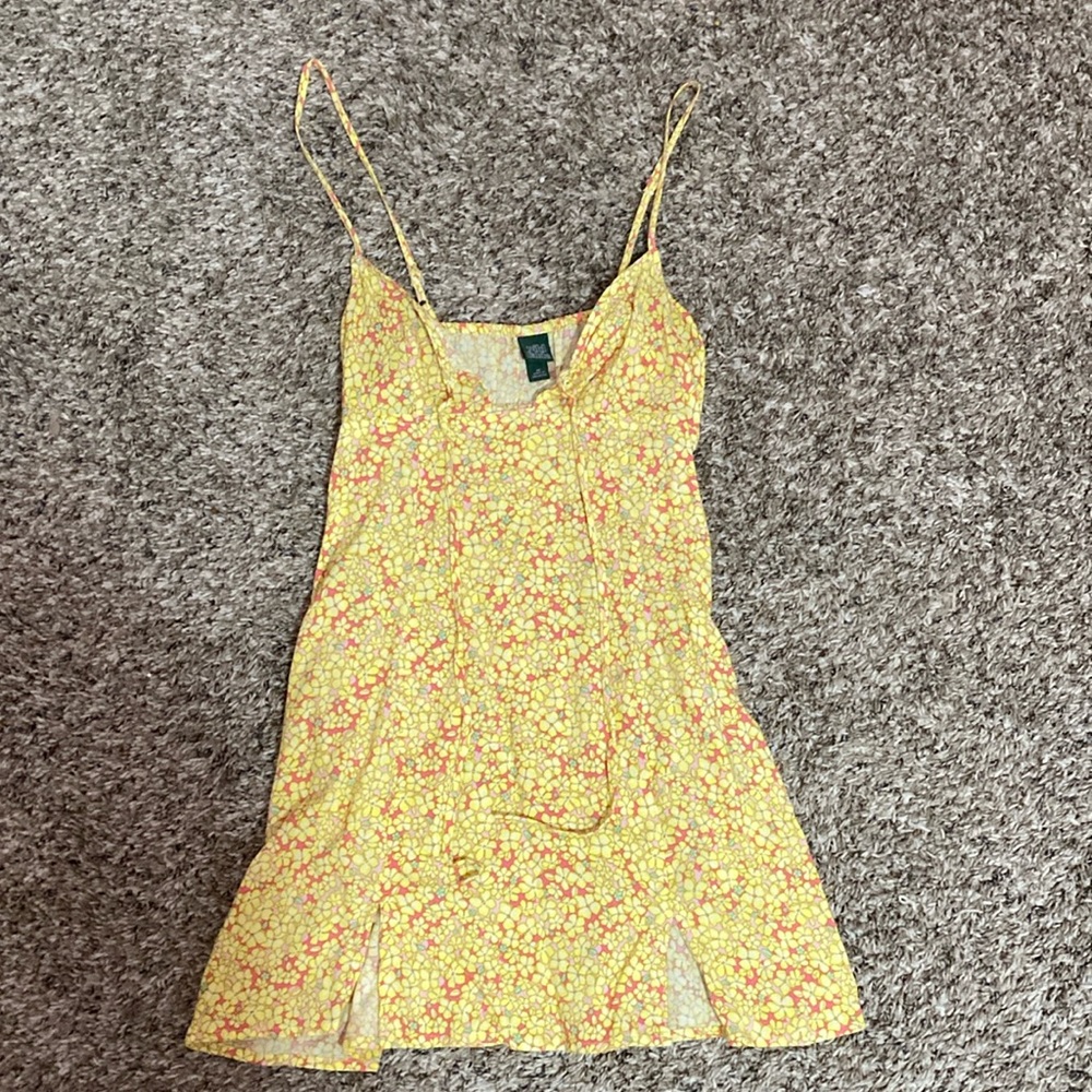 Has pockets, yellow and orange floral print